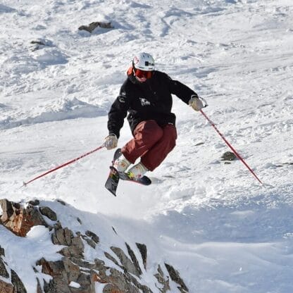 Freeride skier catching air